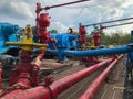 Indonesia-July,2022: Oil drilling mud pumps with pipes and valves