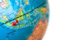 Indonesia map. Earth globe close up with a red pin. Royalty Free Stock Photo