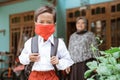 Indonesian asian primary student wearing a masks