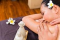 Indonesian Asian woman at wellness spa massage