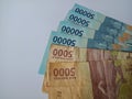 Indonesian bank notes. 50000 and 5000 rupiah banknotes. Blue and brown banknotes. White isolated background . Means of payment