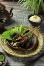 Indonesian beef satay served with pickles and lettuce