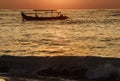 Indonesian boats in ocean at sunset