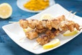 Indonesian chicken satay skewers with curry , peanut butte