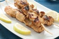 Indonesian chicken satay skewers with curry , peanut butter