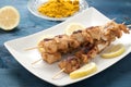 Indonesian chicken satay skewers with curry , peanut butter