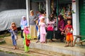 Indonesian Children looking at the camera with funny faces out of the shop. West Java, Indonesia