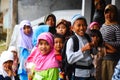 Indonesian Children looking at the camera with funny faces out of the shop. West Java, Indonesia