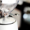 Indonesian coffee beans inside grinding machine