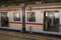 Indonesian commuters wait inside the cars at the station in Jakarta