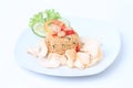 Indonesian dish : fried rice nasi goreng served prawn crackers on white plate