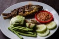 Indonesian dish ikan goreng fried fish close-up