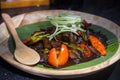 Indonesian dish from Jakarta - Oseng Kikil Mercon Kecap, dish from stir-fried cowhide