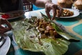 Indonesian dish - PEPES IKAN from banana leaf on plate
