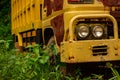 An old, rusty, abandoned yellow and beige truck Royalty Free Stock Photo