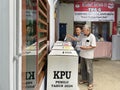 Indonesian election, inserting voting cards into the ballot box Royalty Free Stock Photo