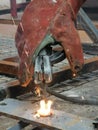 Indonesian electric welder in the job