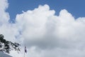 Indonesian flag isolated on blue sky with clipping path. close up of flying the red and white flag Royalty Free Stock Photo