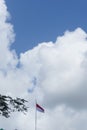 Indonesian flag isolated on blue sky with clipping path. close up of flying the red and white flag Royalty Free Stock Photo