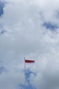 Indonesian flag isolated on blue sky with clipping path. close up of flying the red and white flag Royalty Free Stock Photo