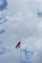 Indonesian flag isolated on blue sky with clipping path. close up of flying the red and white flag Royalty Free Stock Photo