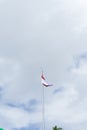 Indonesian flag isolated on blue sky with clipping path. close up of flying the red and white flag Royalty Free Stock Photo