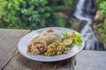 Indonesian food, tuna and rice in a cafe on the background of a waterfall Royalty Free Stock Photo
