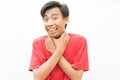 Indonesian guy trying to suffocate himself thumbs up on a white background