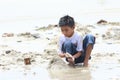 Indonesian kid - boy playing on beach