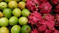 Indonesian local fruits: guavas and dragon fruits at supermarket display Royalty Free Stock Photo