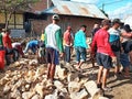 Indonesian local people working together building neighbor's house, Asian male construction workers and labor day Royalty Free Stock Photo