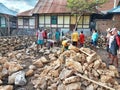 Indonesian local people working together building neighbor's house, Asian male construction workers and labor day Royalty Free Stock Photo