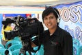 Indonesian local TV cameraman with his camera.