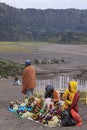 Indonesian locals selling flowers to tourists on Mount Bromo, Java Indonesia