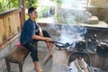 Indonesian man roasting coffee Kopi Luwak