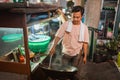 indonesian man stirring fried rice cooking oriental food