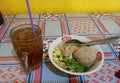Indonesian meatballs and iced tea Royalty Free Stock Photo