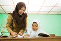 Indonesian muslim teachers who are helping their students