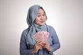 Indonesian Muslim Woman Holding Rupiah Money Royalty Free Stock Photo