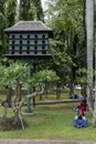 Indonesian people enjoy a day off at Medan Merdeka next to a bird house in Jakarta, Indonesia