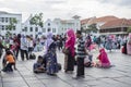 Indonesian people enjoy themselves at Fatahillah Square in Jakarta