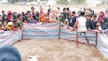 Indonesian people are gathering and playing games together to celebrate Indonesia's Independence Day. Many kids, women, men