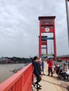 Indonesian people, Vehicles crossing Ampera Bridge over Musi river.