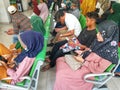 Indonesian People Waiting in Line at the Hospital of RSUD or Rumah Sakit Umum Daerah
