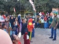 Indonesians watching a competition "Lomba Makan Kerupuk" in celebrating Indonesia's Independence Day