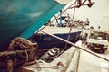 Indonesian port workers unload a ship with a flour bags cargo in