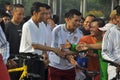 Indonesian President Joko Widodo while cycling greets residents Royalty Free Stock Photo