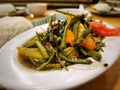 An Indonesian restaurant dish called cah kangkung