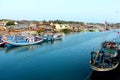 Indonesian river dock fishing boats and community housing