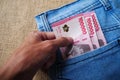Indonesian Rupiah cash money in a jean pocket Royalty Free Stock Photo